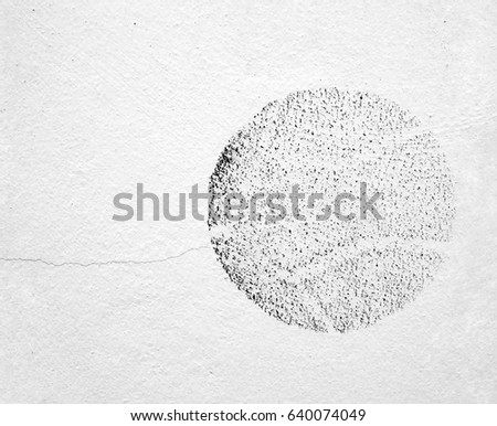 traces of soccer ball imprint and crack on white concrete wall, dirt stain on cement surface caused by kicking soccer ball hits stadium wall, abstract sports background, close up white copy space