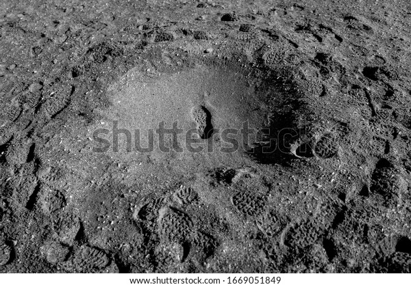 Traces\
of steps on the moon\'s surface in a soft light. Space travel\
through spaceflight companies in the near future to planets that\
can support life. The future of humanity on\
Mars.