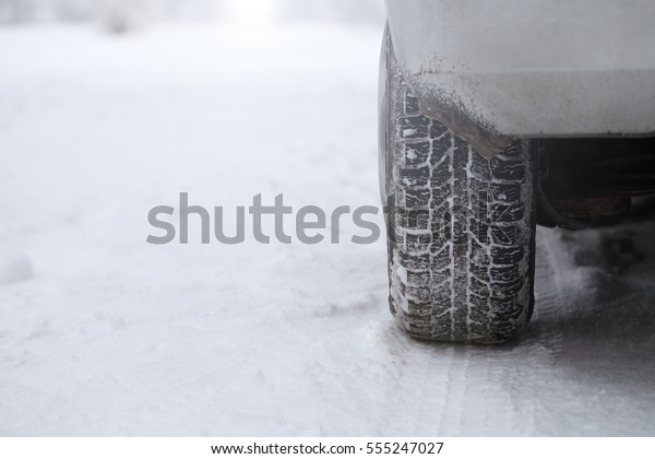 Traces of the wheels of the machine in snow,\
texture print.