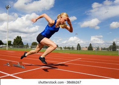 Track Athlete Exploding Out Of The Starting Blocks