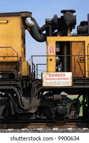 A track grinding train which grinds rails to provide longer service life