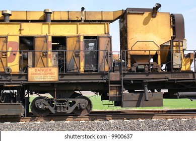 A track grinding train which grinds rails to provide longer service life