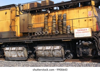 A track grinding train which grinds rails to provide longer service life