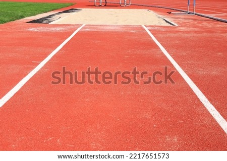 Track lines for jumping at a Stadium. Sandbox to land on in the background. Bålsta, Stockholm, Sweden.