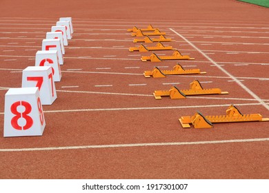 Track numbers and starters on the plastic track on the playground