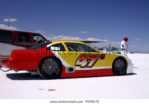 Track official give the start\
signal to a driver at Bonneville Salt Flats in Utah 11 August\
2007