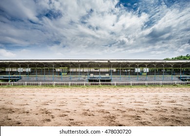 Track of racecourse with old wooden grandstand