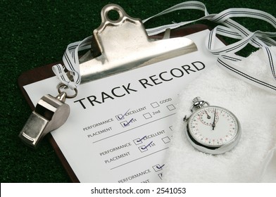 Track Record On Clip Board With Stop Watch, Whistle And Towel