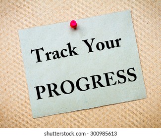 Track Your Progress Message Written On Recycled Paper Note Pinned On Cork Board. Motivational Concept Image