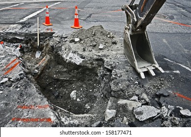 Tracked Excavator On The Street Asphalt Road Repair