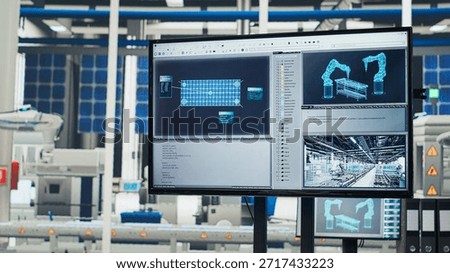 Tracking program on screen in photovoltaics factory used for designing production lines for solar panel assembly facility. Simulation software on monitor in empty solar panels plant