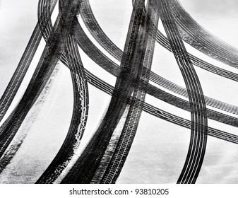 Tracks Of Car Tires In Thin Layer Of First Snow