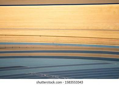 Tracks Of An Indoor Track Cycling Velodrome With Wooden Course Race-track And Blue Floor