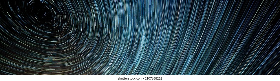 Tracks of stars in the night sky - Shutterstock ID 2107658252