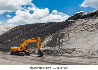 Track-type loader, excavator machinery in open pit or open-cast coal mine the mining industry that large, or huge machine used in bulk material handling in stockpile as the Coal Production.