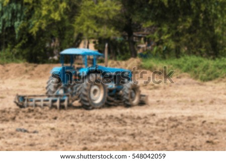 tractor for agriculture take by lens blur
