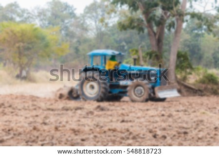 tractor for agriculture take by lens blur