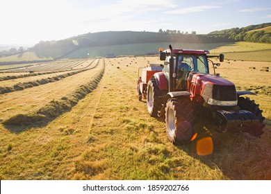 Tractor Baling Hay In The Field