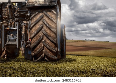 Tractor from behind in a field during harvest
 - Powered by Shutterstock