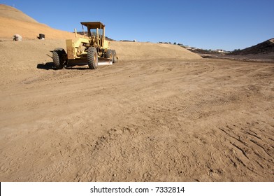 Tractor At A Construction Site And Dirt Lot.