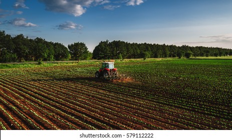 Tractor Cultivating Field At Spring,aerial View