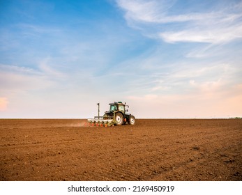 Tractor drilling seeding crops at farm. Agricultural activity. - Shutterstock ID 2169450919