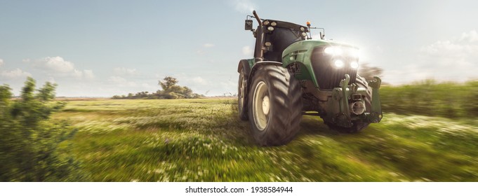 Tractor driving on a dirt road next to a field