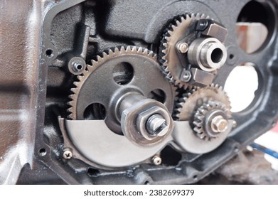 The tractor engine is being opened and repaired, diesel tractor, parts of plowing equipment, hand tractor, external view, chimney, wheels, oil cap and handlebar, onderdile diesel machine, turn off 