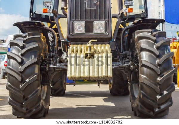 Tractor for farm work, modern
agricultural transport working in the field, modern tractor
close-up