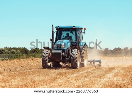 tractor, tractor, farmer harvesting with tractor. Tractor working in the field