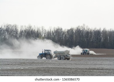 Tractor fertilizes agricultural fields for planting soybean