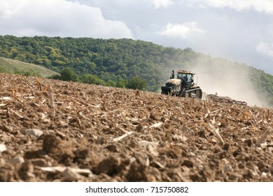 tractor in field - Shutterstock ID 715750882