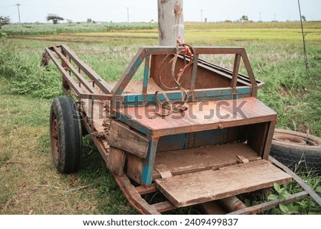tractor liaison vehicle in a parked rice field.