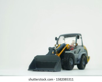 Tractor Or Loader Excavator For Earth Moving Works At Construction Site, Miniature Earth Mover Frontend Loader, Toy Loader Digger, Toy Industrial Vehicle.