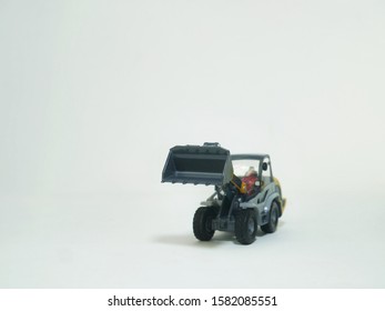 Tractor Or Loader Excavator For Earth Moving Works At Construction Site, Miniature Earth Mover Frontend Loader, Toy Loader Digger, Toy Industrial Vehicle.