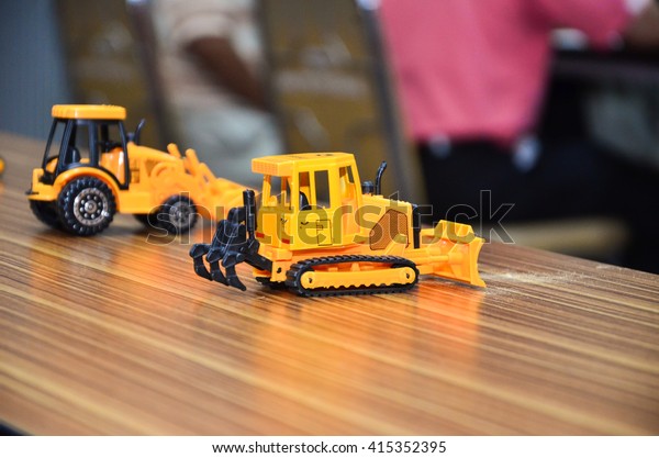 TRACTOR model Toy on wood\
Table