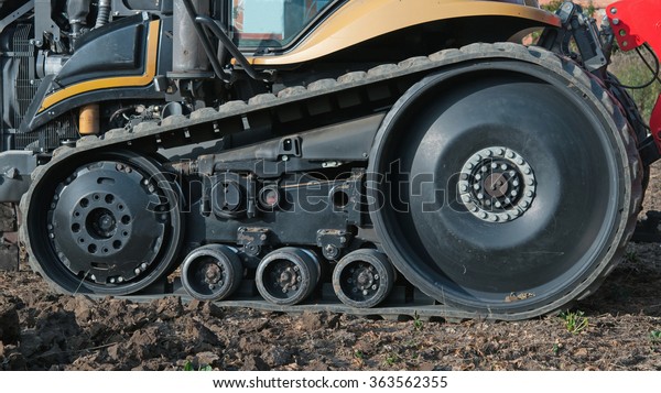tractor outside with rubber\
crampons