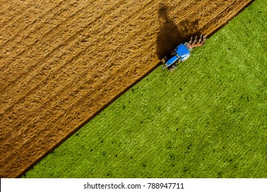 Tractor Ploughing Field Aerial View