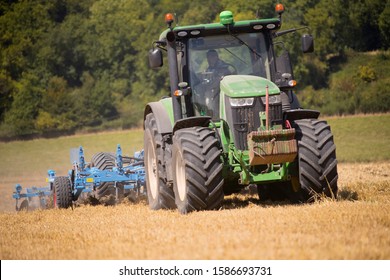 Tractor Ploughing Field Using Disc Plough