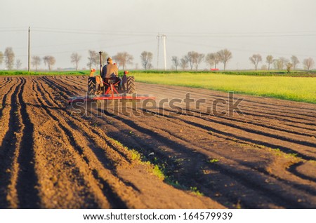 Image, Stock Photo Tractor plowing field