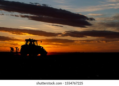 Tractor plowing fields -preparing land for sowing 