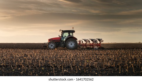 Tractor plowing fields -preparing land for sowing