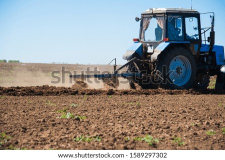 Similar – Image, Stock Photo Tractor plowing field