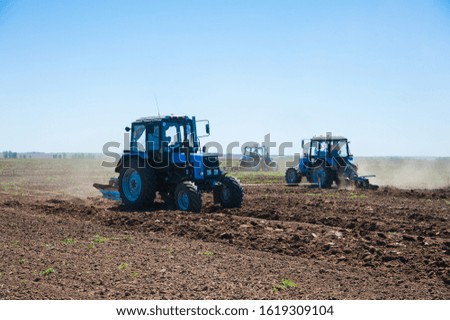 Similar – Image, Stock Photo Tractor plowing field