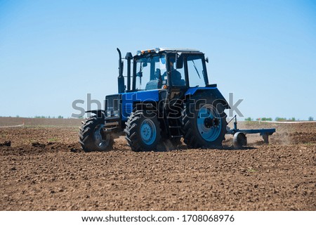 Similar – Image, Stock Photo Tractor plowing field