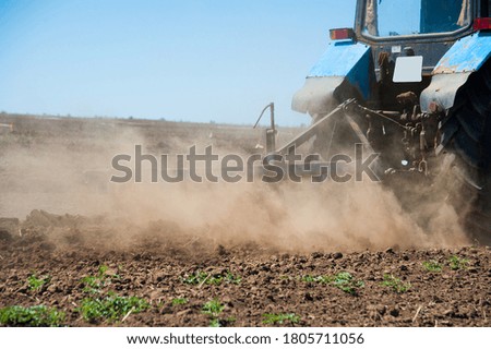 Similar – Image, Stock Photo Tractor plowing field