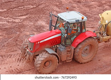 Tractor Pulling A Water Bowser