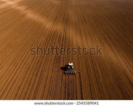 Similar – Erntemaschine, die im Feld arbeitet. Kombinierte Maschine