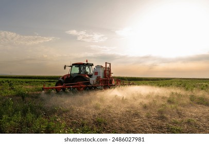 A tractor sprays chemicals to control pests and weeds in crops