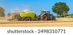 Tractor with straw baler on the harvested grain field - 8383